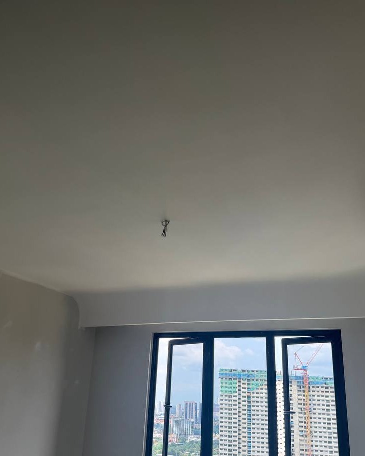 Smooth plaster ceiling with curved cornice edge and concealed wiring point in high-rise condo unit, Bangsar