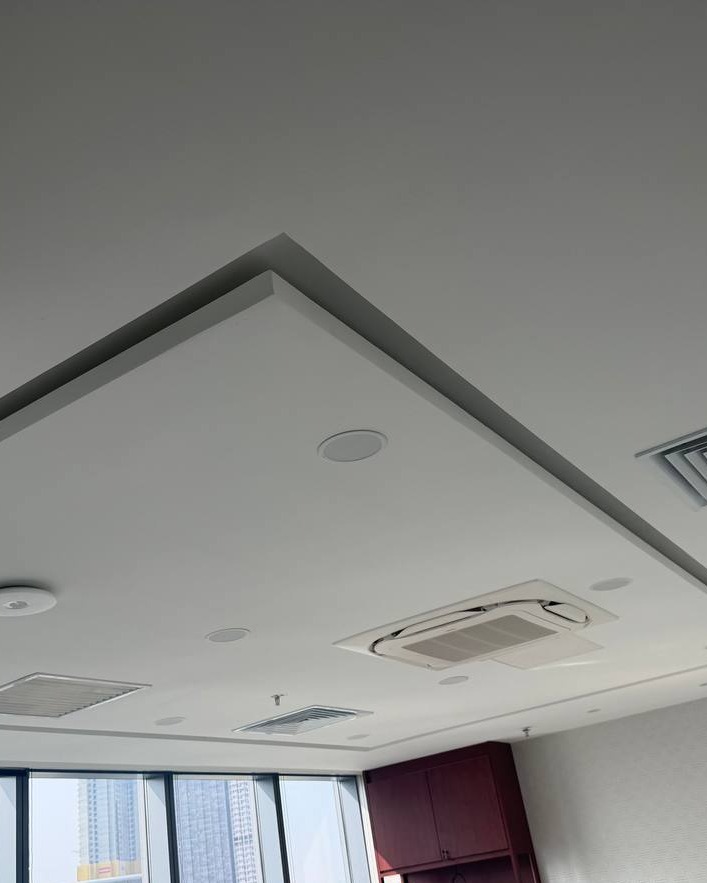 Recessed square plaster ceiling drop with cove edge detail, cassette air-conditioning unit, ceiling speaker and diffusers in Brickfields office plaster ceiling project