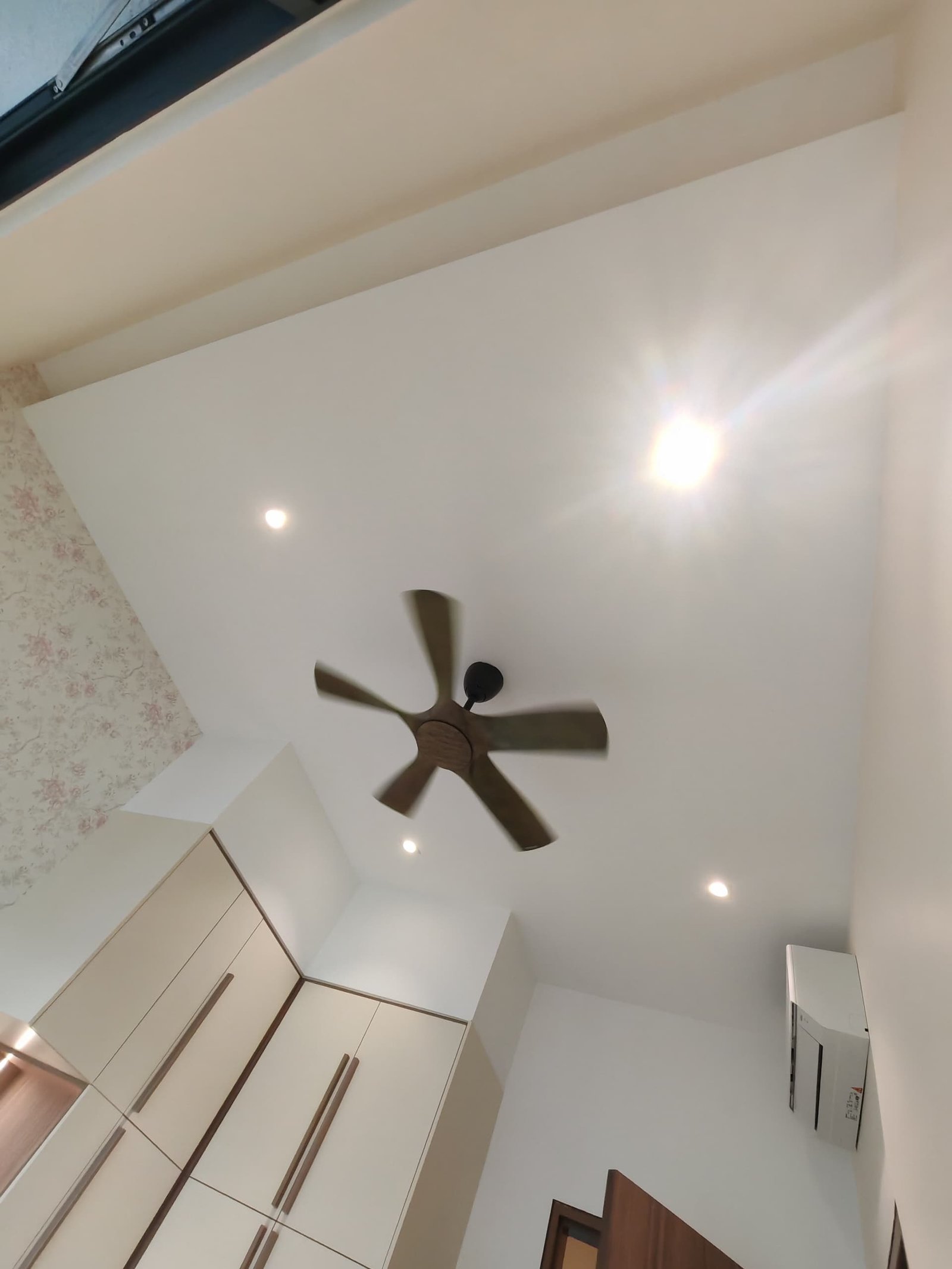 Bedroom Ceiling with Downlights and Ceiling Fan Plaster ceiling with recessed downlights and ceiling fan above a bedroom with floral wallpaper and built-in wardrobe, Sungai Long renovation