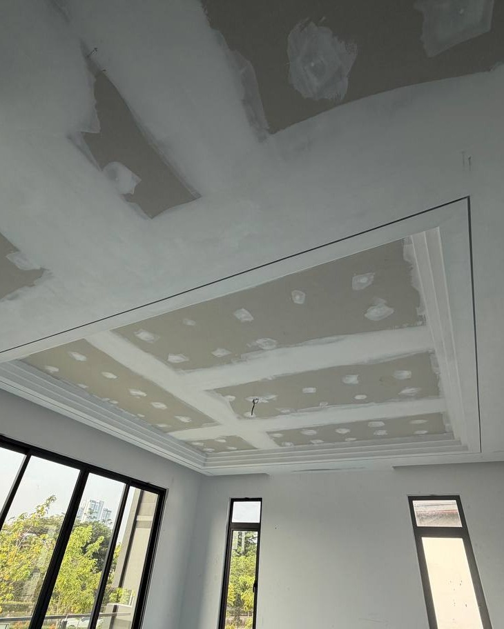 Cove Ceiling Box Mid-Construction, Cyberjaya Unfinished plaster ceiling with recessed cove lighting box and jointing compound patches, Cyberjaya staircase area plaster ceiling project