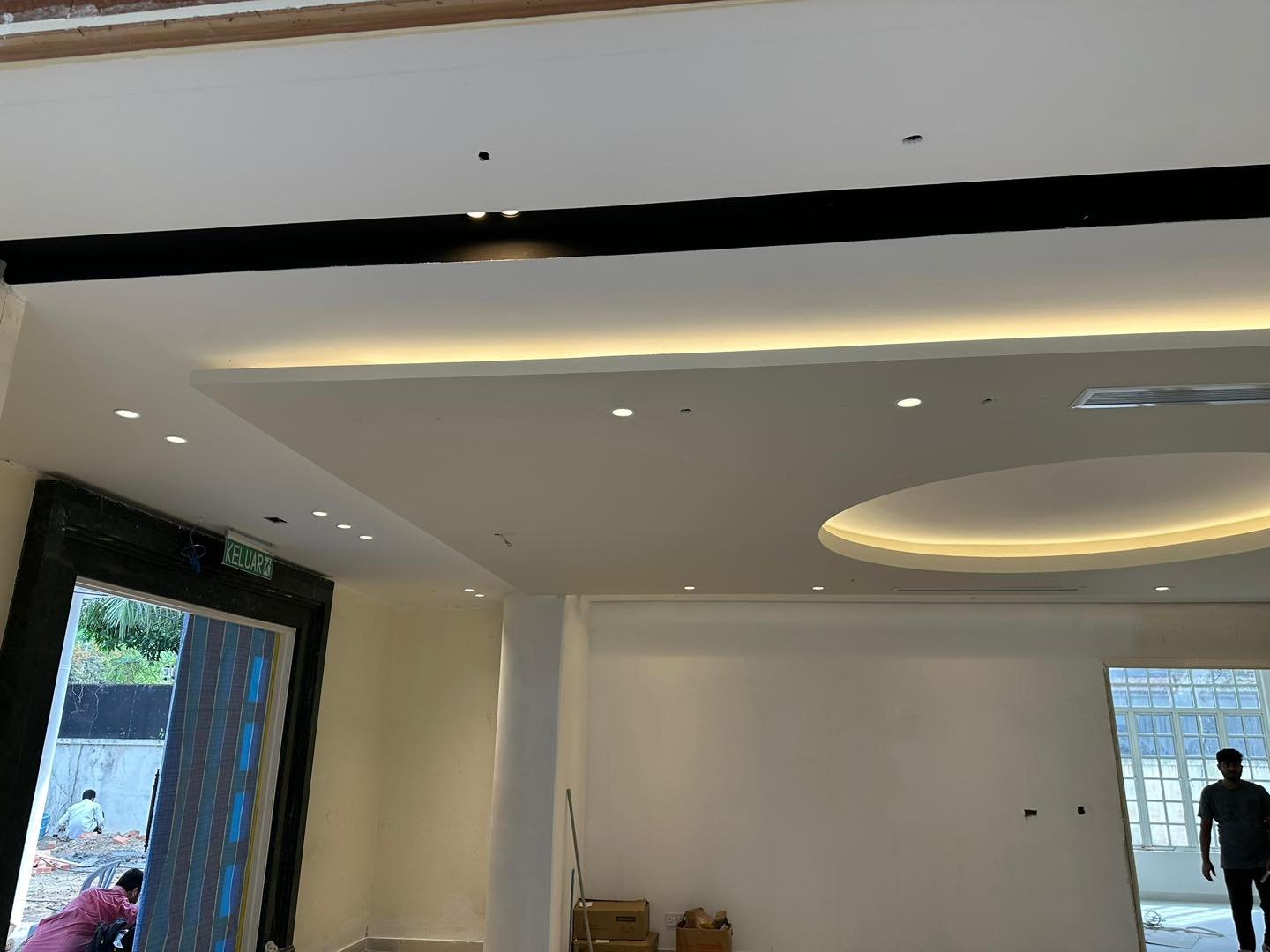 Ceiling Detail Leading to Garden Doorway - KL Bungalow Plaster ceiling with black accent band, downlights and cove lighting leading to a circular floating moon ceiling recess, opening onto a garden doorway, Kuala Lumpur bungalow renovation