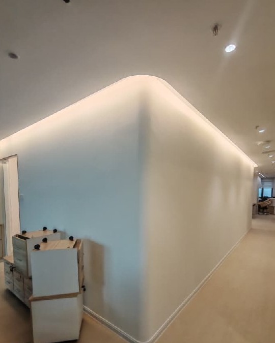 Curved Partition Wall with Cove Lighting — Southbank Residence Office Curved plaster partition wall with cove lighting concealing seamless LED glow along ceiling junction, office renovation Old Klang Road Kuala Lumpur