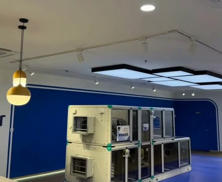 Floating ceiling panels with track lights over an office showroom area, Shah Alam office renovation