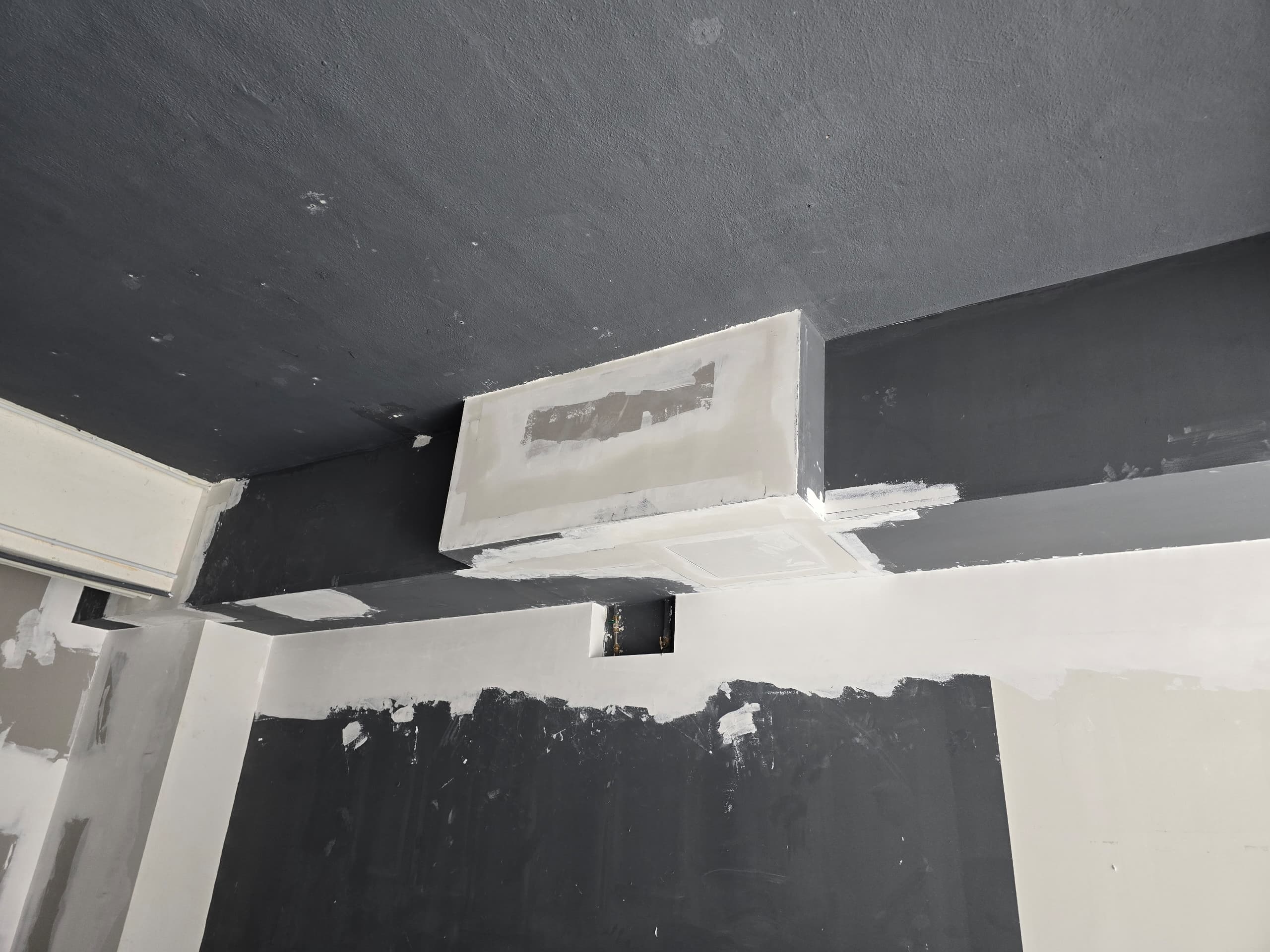 Ceiling bulkhead under construction Barberroom by Jiro fit-out — black plaster ceiling bulkhead under construction